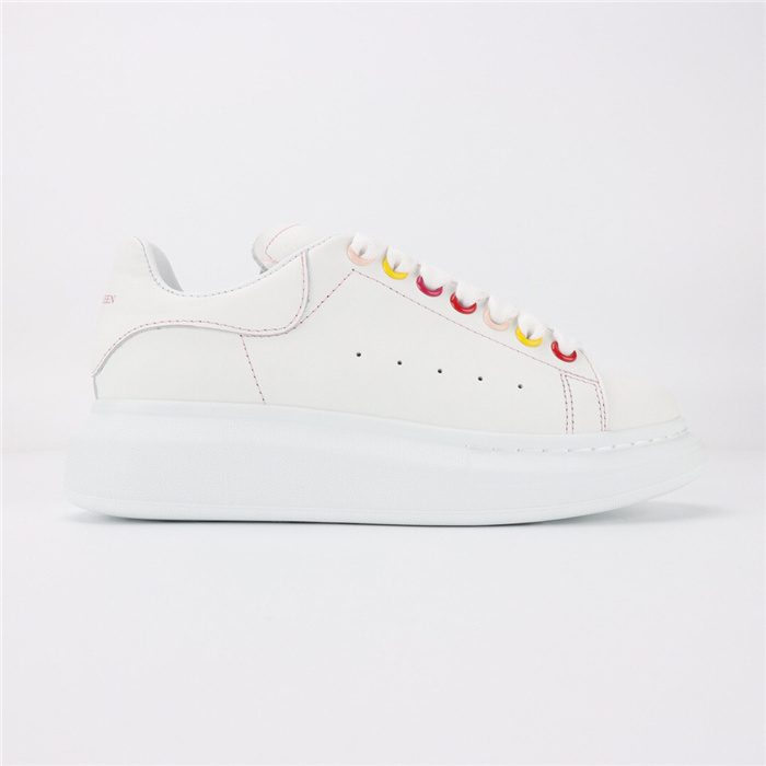 Alexander McQueen Oversized sneaker in white calf leather with rainbow eyelets and contrast stitching.