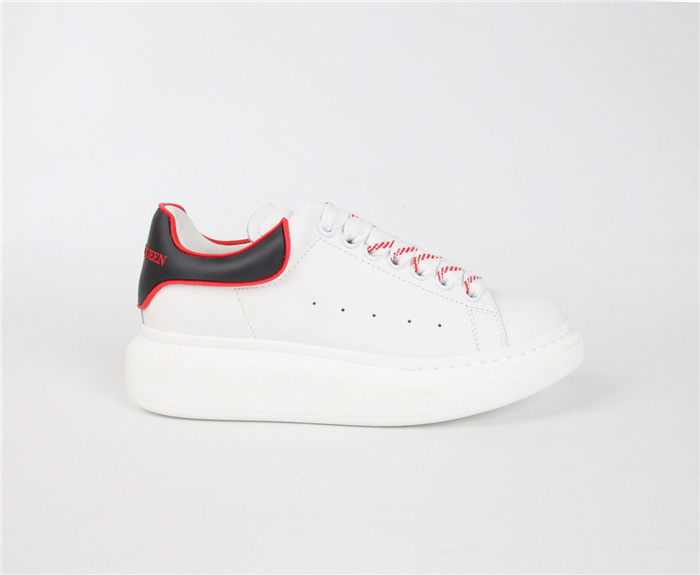 Alexander McQueen Oversized Sneaker in white calf leather with a black heel detail and red outline accents