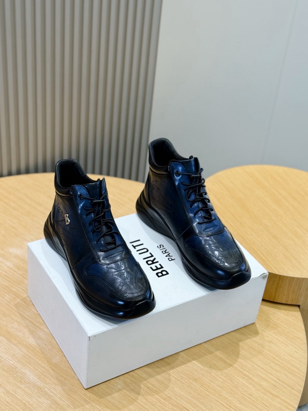 Berluti men's ankle boot in blue Venezia leather with a black rubber sole