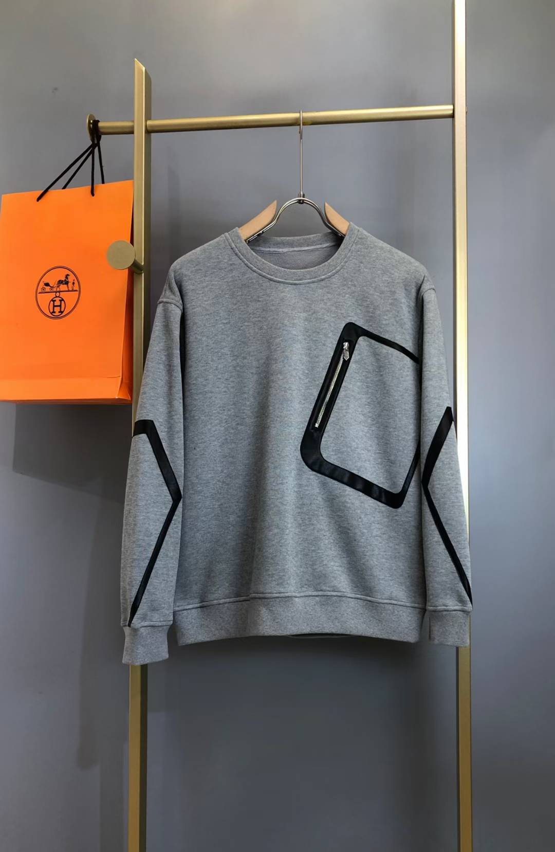 Hermes zip-pocket sweater with black leather trim