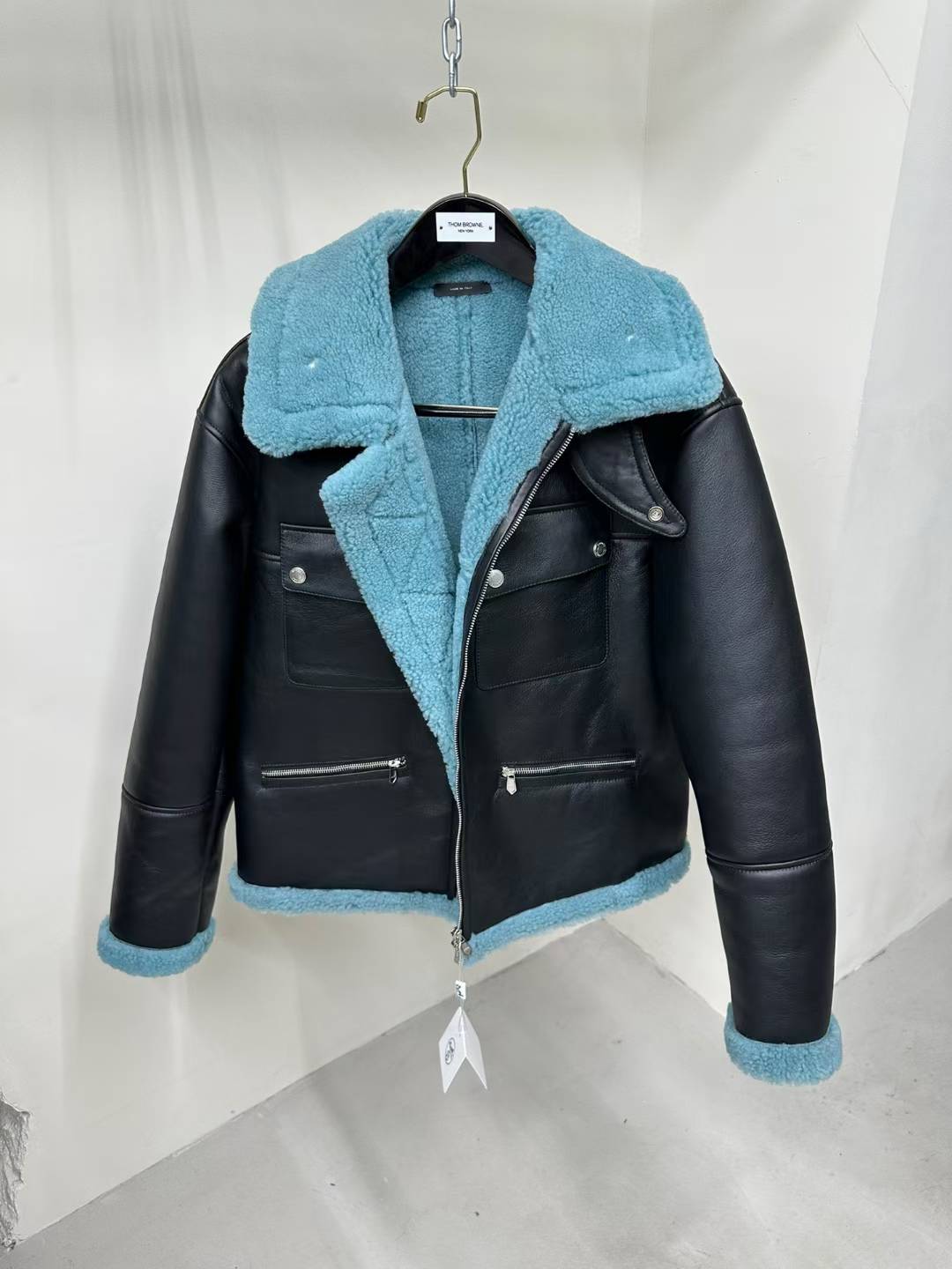 Hermes black leather shearling jacket with a turquoise blue