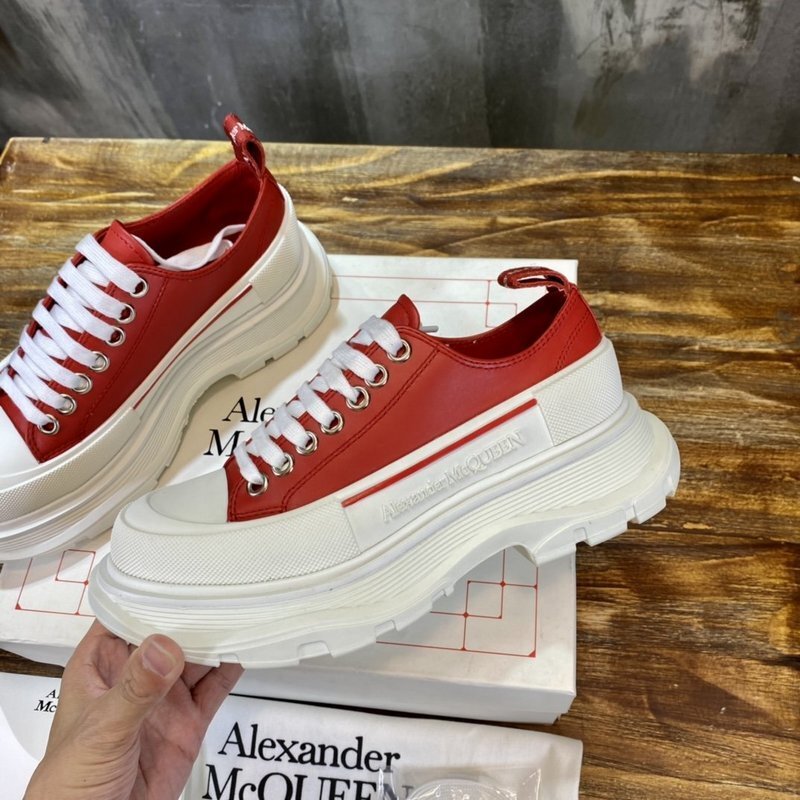 Alexander McQueen Tread Slick lace-up sneaker in a red and white