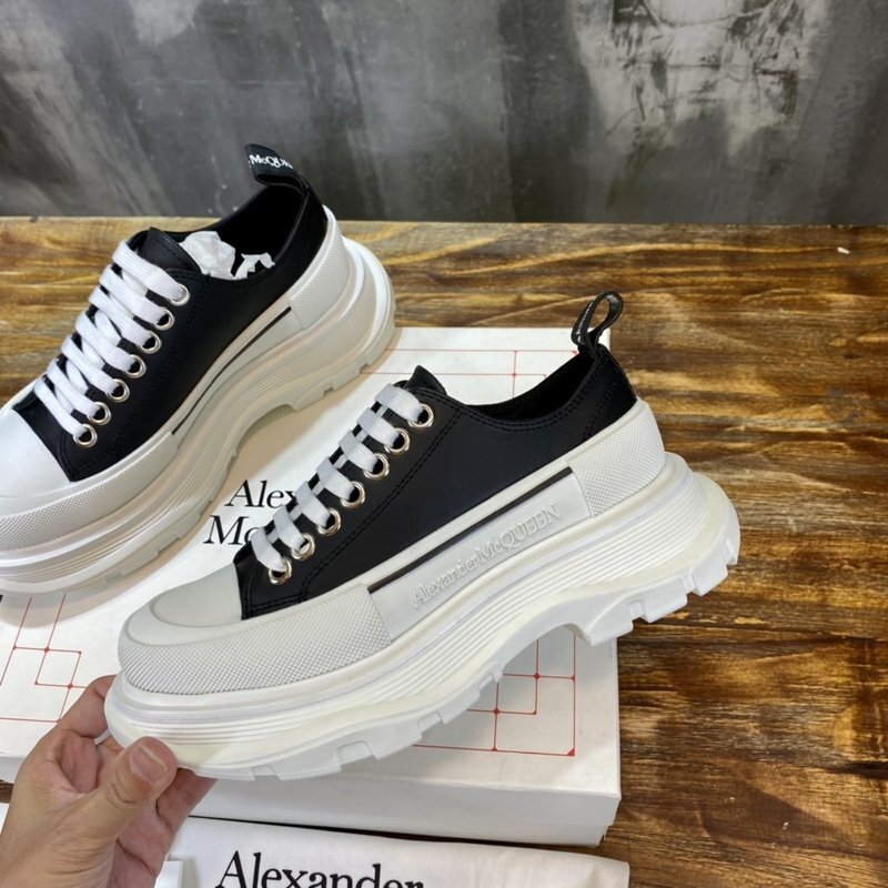 Alexander McQueen Tread Slick low-top sneaker in black and white canvas