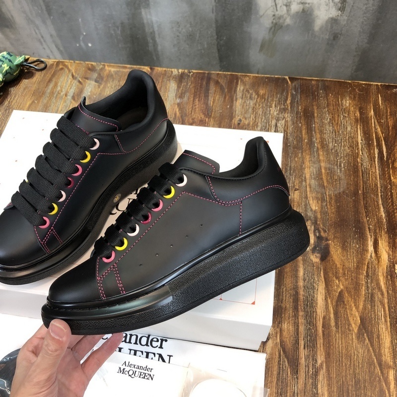 Alexander McQueen Oversized Sneaker in black leather with rainbow eyelets