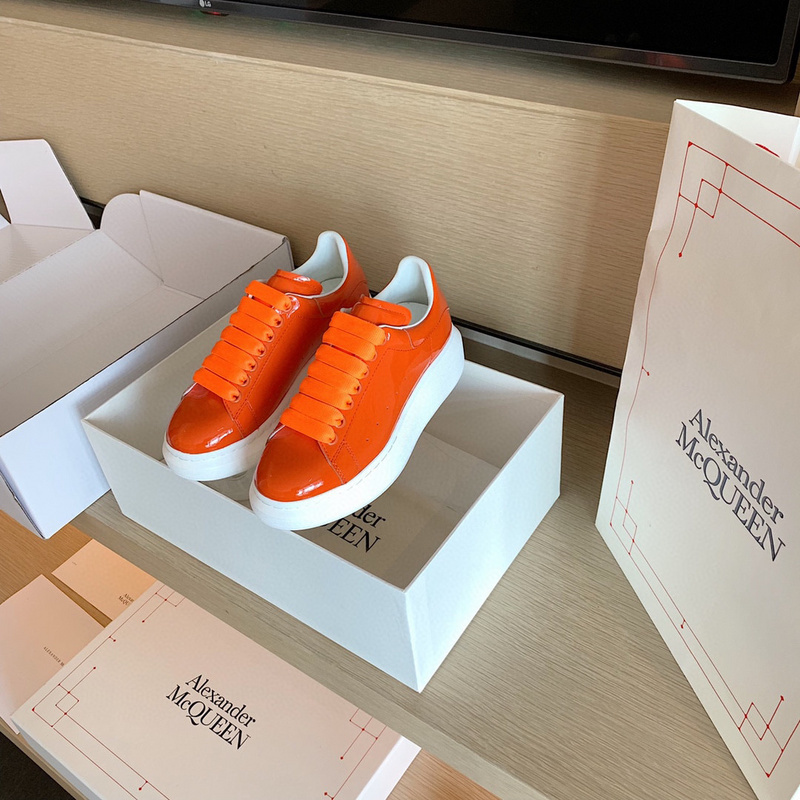 Alexander McQueen Oversized Sneakers in a vibrant orange patent leather