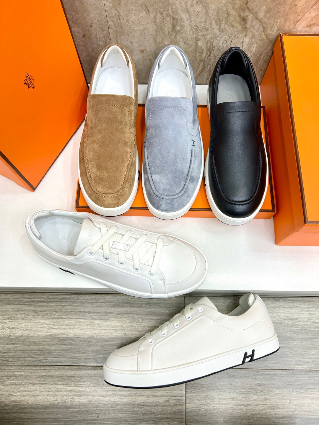 Hermès Kiddy slip-on sneaker in suede goatskin with the signature "H" detail.