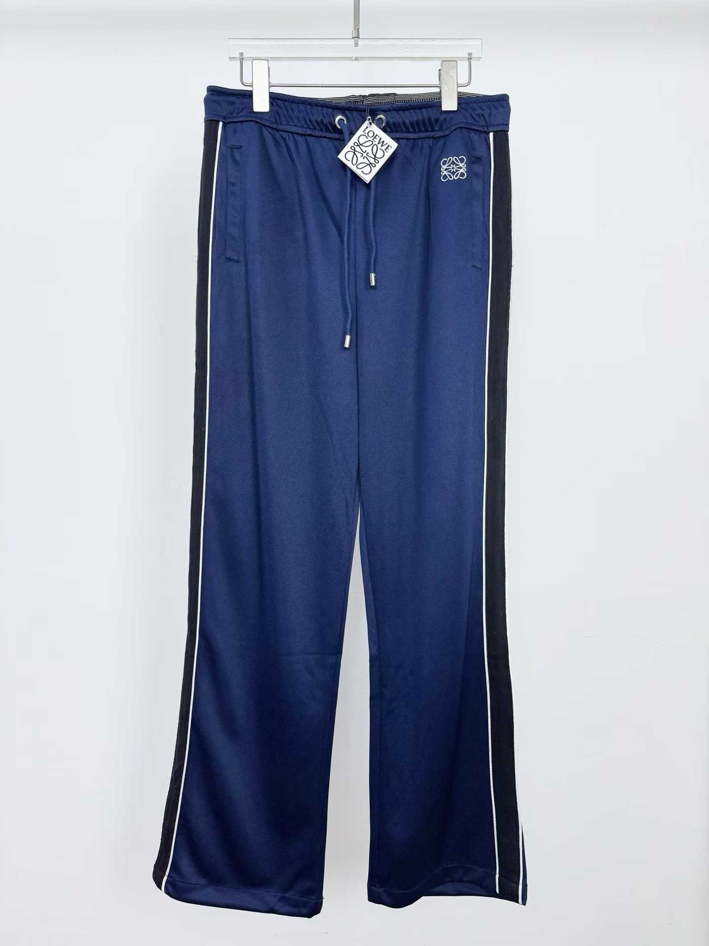Loewe Anagram jersey tracksuit trousers in dark navy blue polyamide and cotton blend with black side stripes