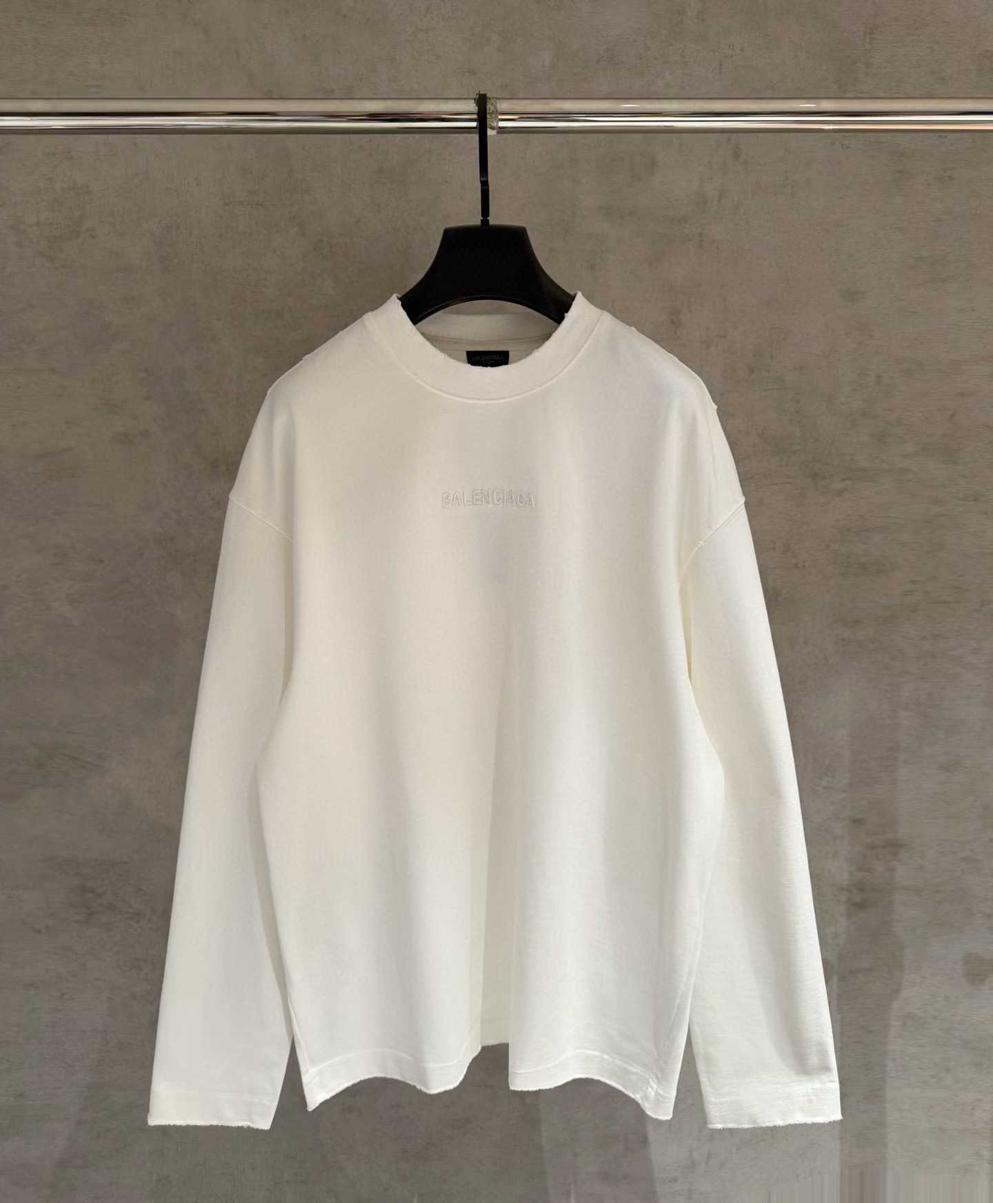 Balenciaga Garde-Robe crewneck sweater in cream cotton with a small stamped logo on the breast.