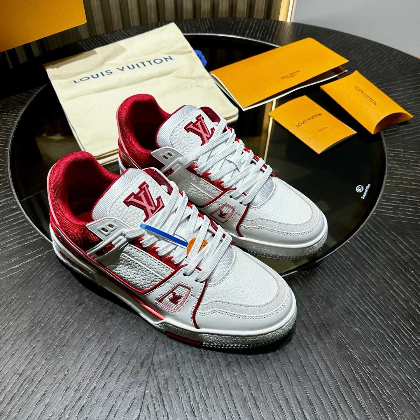 LV Trainer sneaker in a white and red