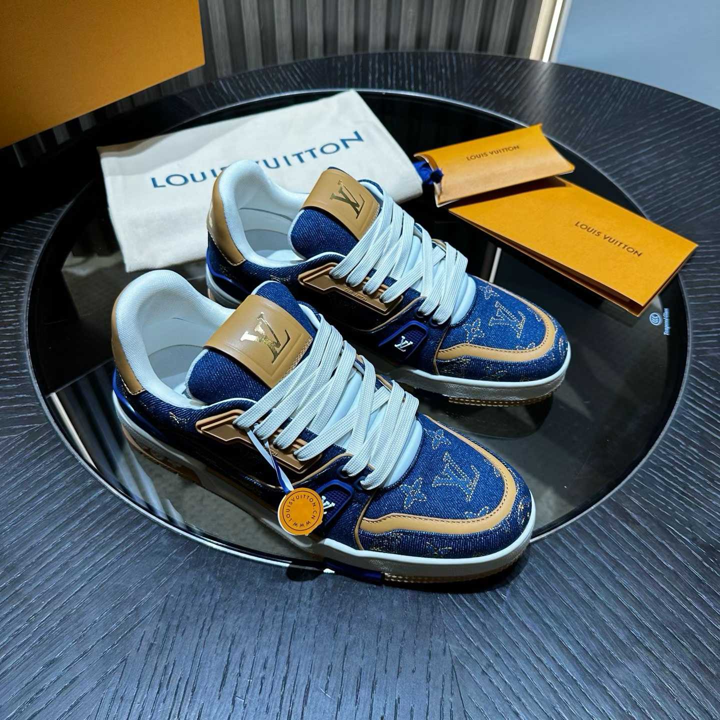 LV Trainer sneaker in Monogram denim and Monogram-embossed grained calf leather