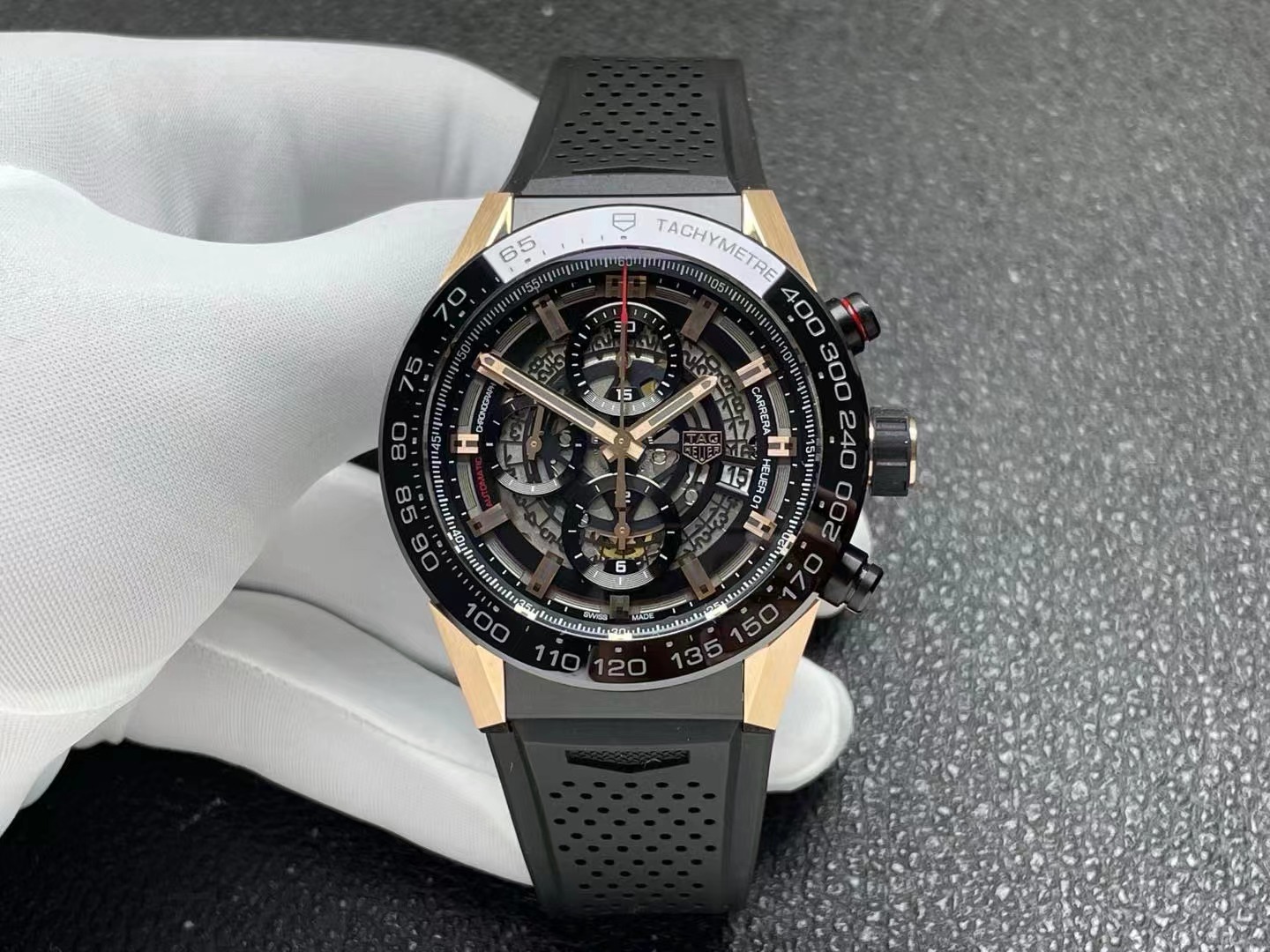 TAG Heuer Carrera Calibre Heuer 01 automatic chronograph watch with a skeleton dial and rose gold accents