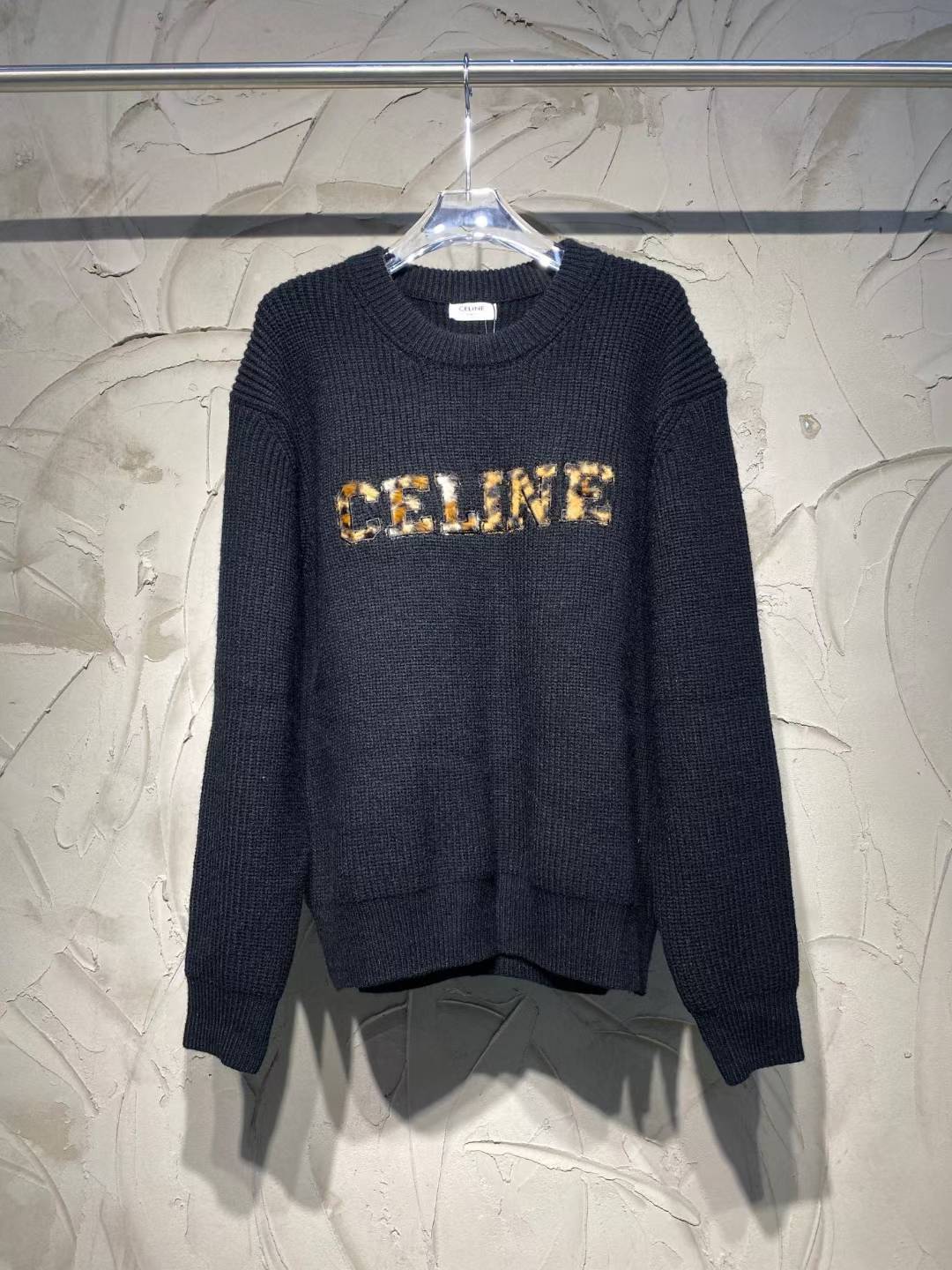 Celine oversized sweater in ribbed wool with a leopard print logo