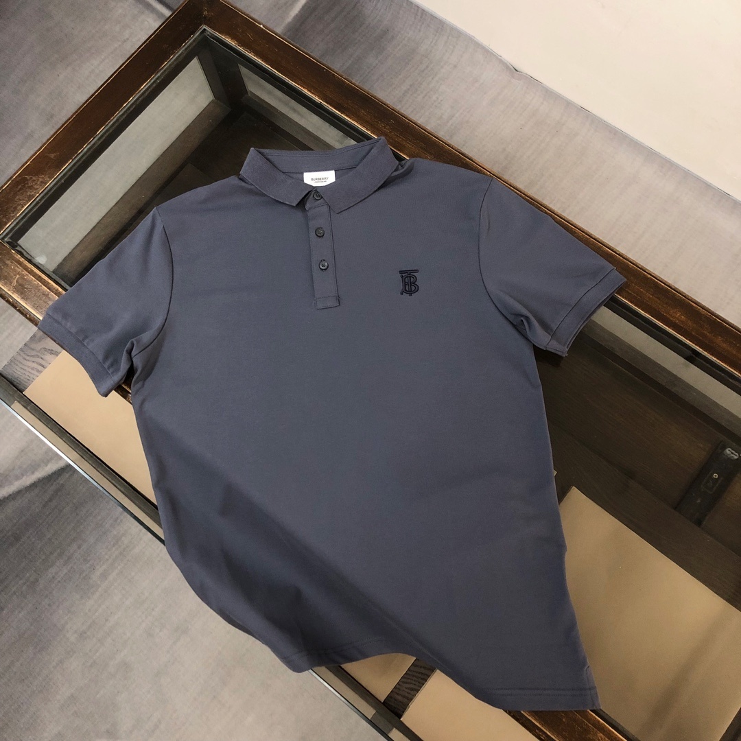 Burberry Malleco Logo Pique Polo Shirt in a dark blue or grey color with a tonal embroidered logo on the chest.