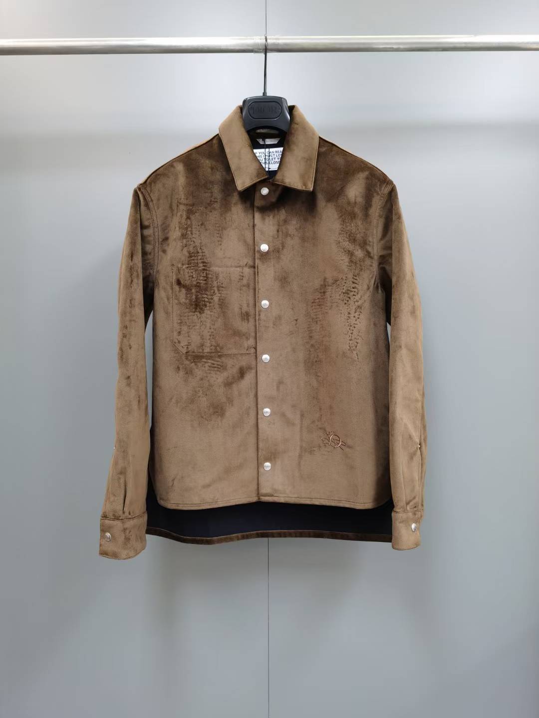 Dior x Travis Scott Cactus Jack logo embroidered suede jacket in brown.