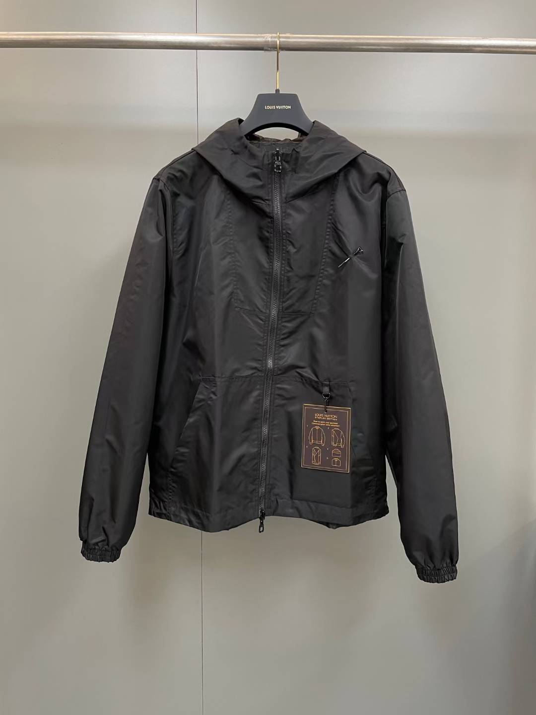 LV Monogram Reversible Nylon Windbreaker in black hoodie