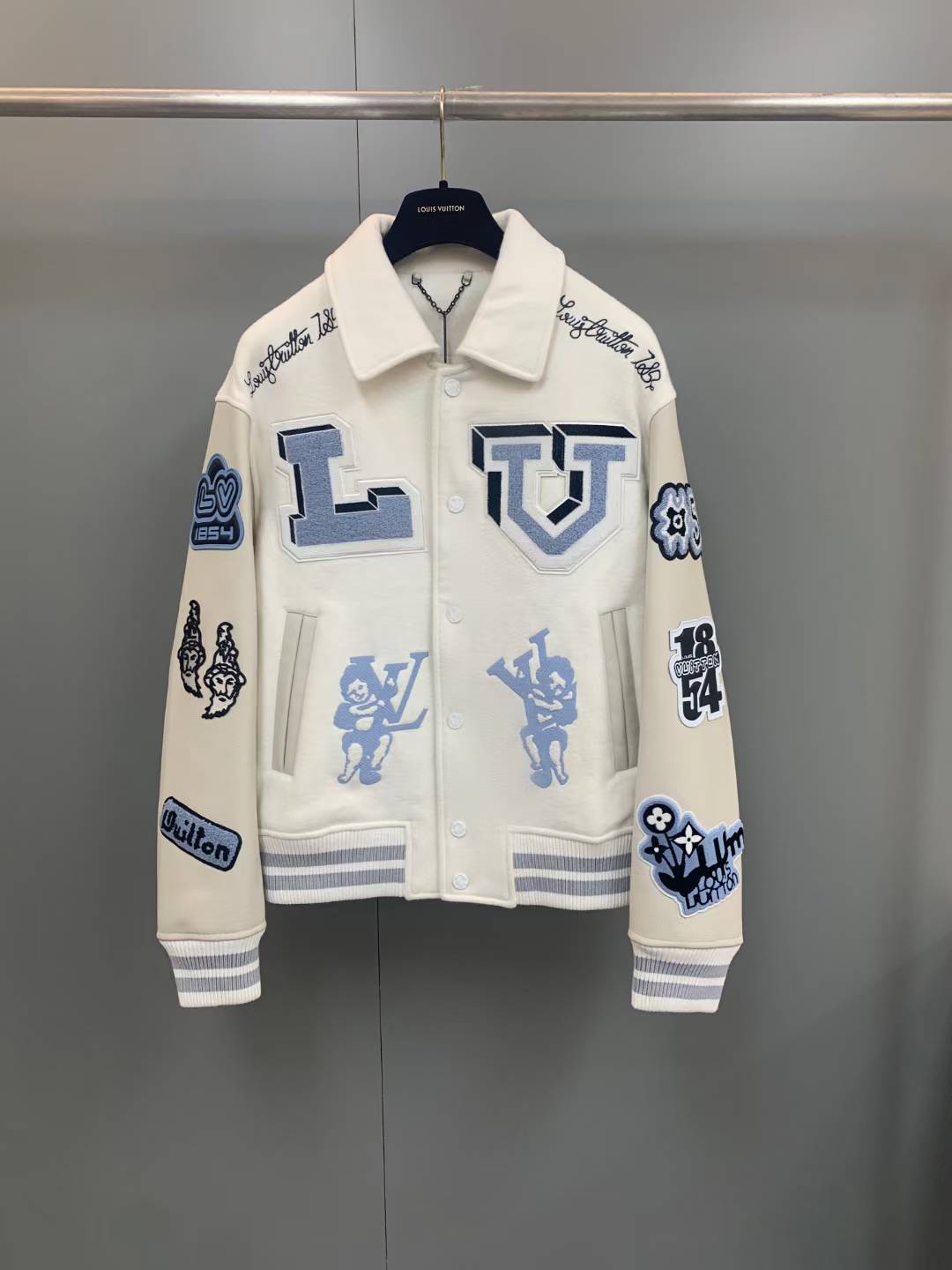 LV Multi-Patches Mixed Leather Varsity Blouson in milky white from the FW22 collection