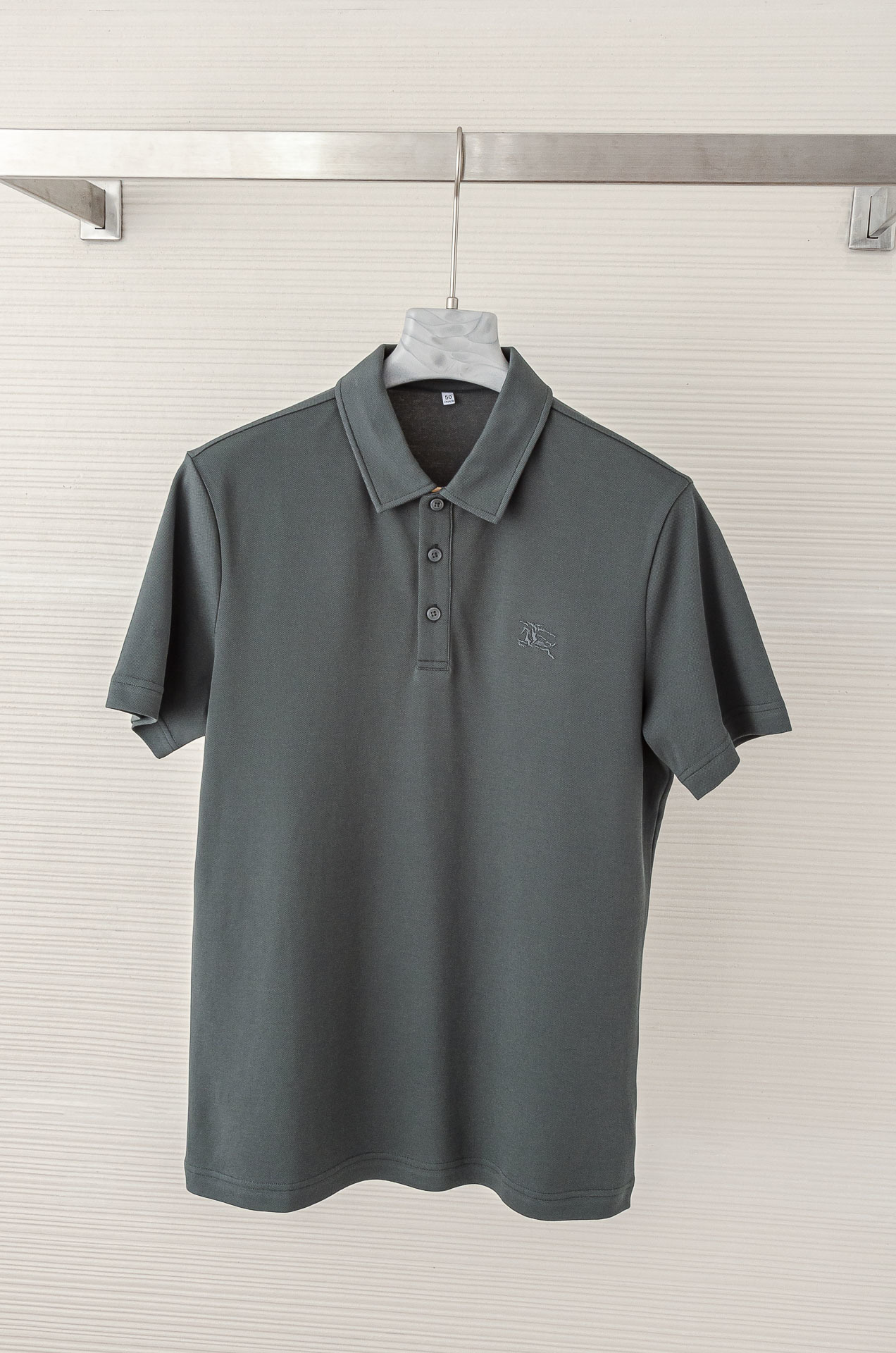 Burberry men's solid grey polo shirt.
