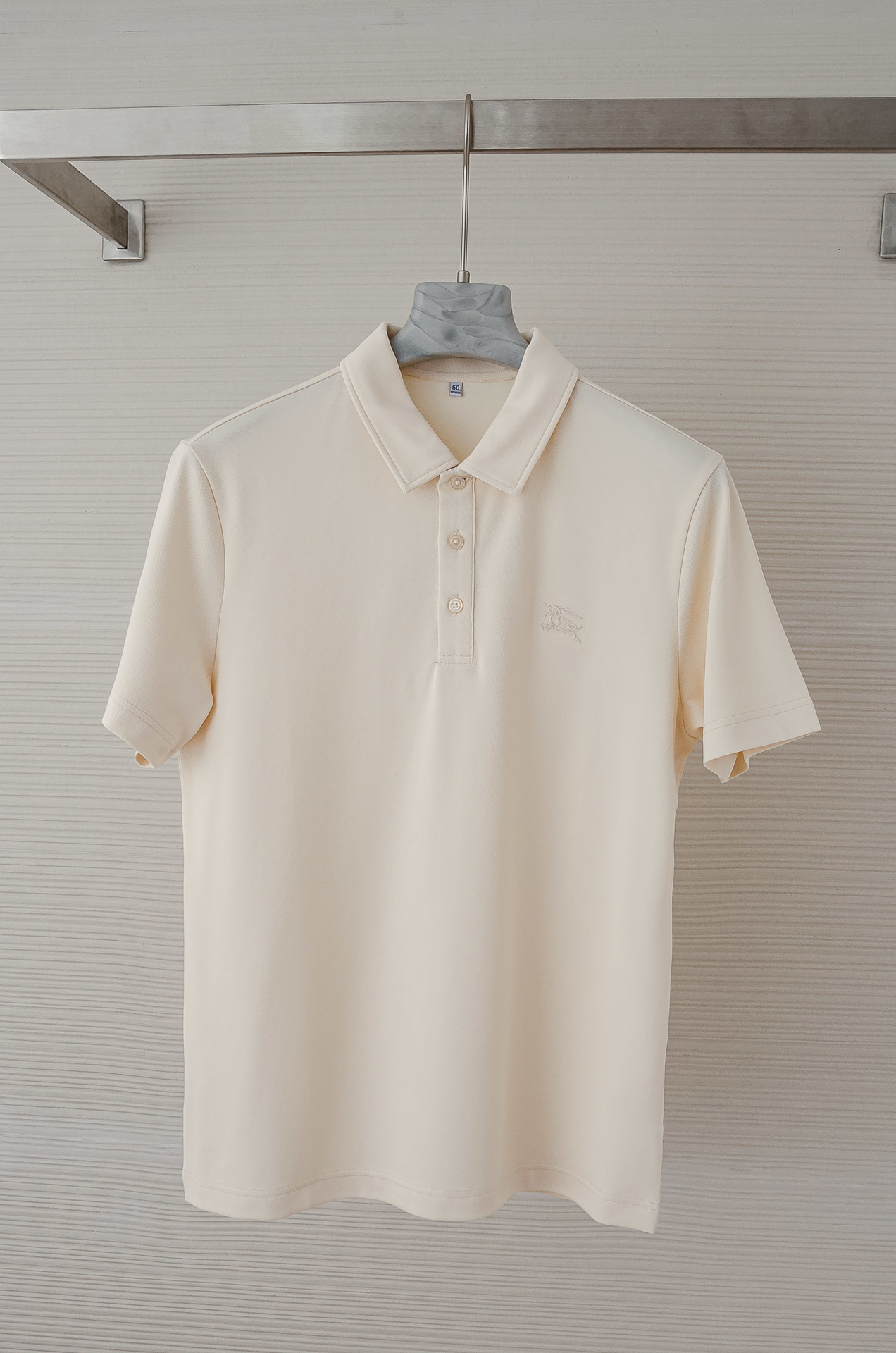 Burberry slim fit cotton polo shirt in clam, featuring an embroidered Equestrian Knight Design at the chest.