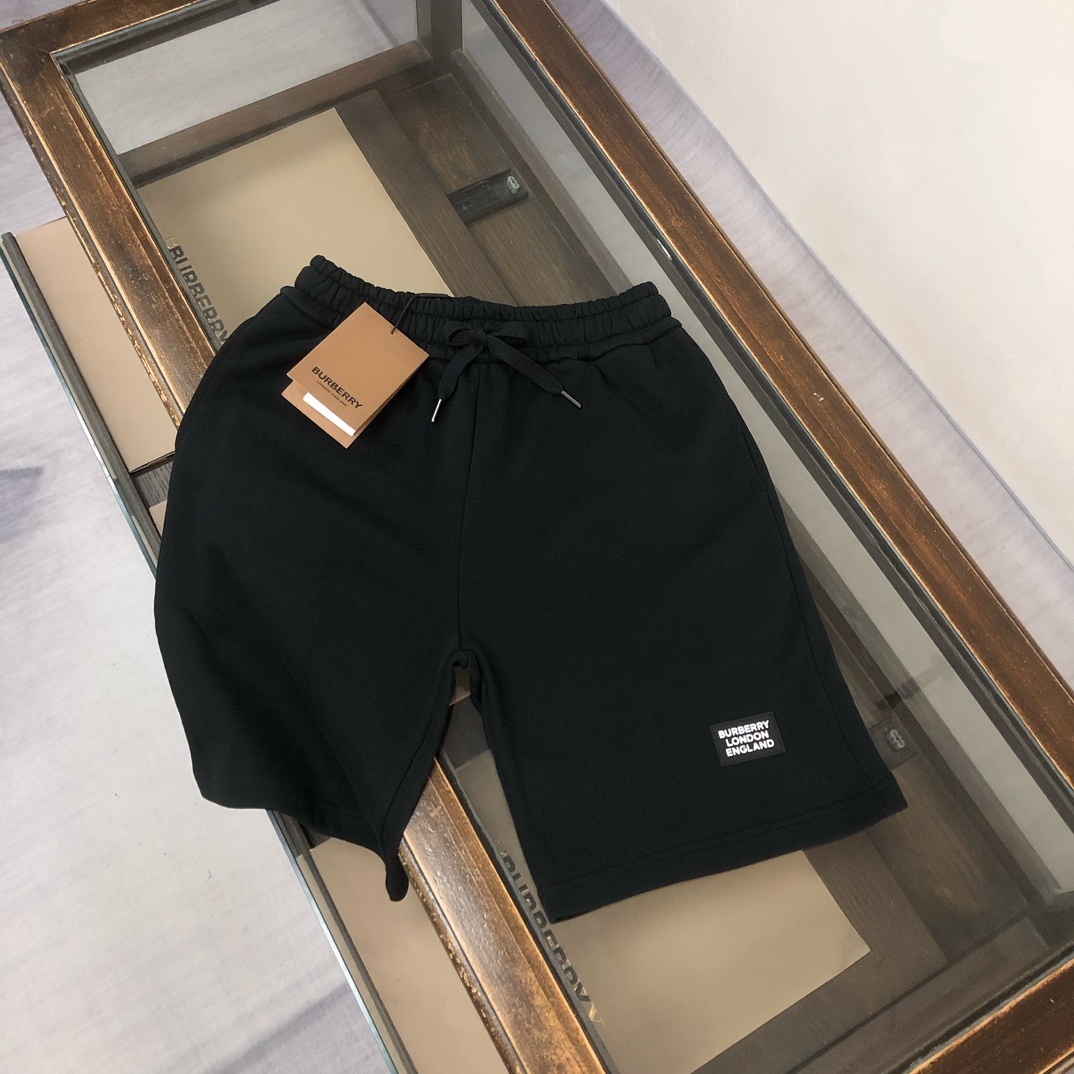 Burberry cotton-blend shorts with a logo patch and drawstring closure.