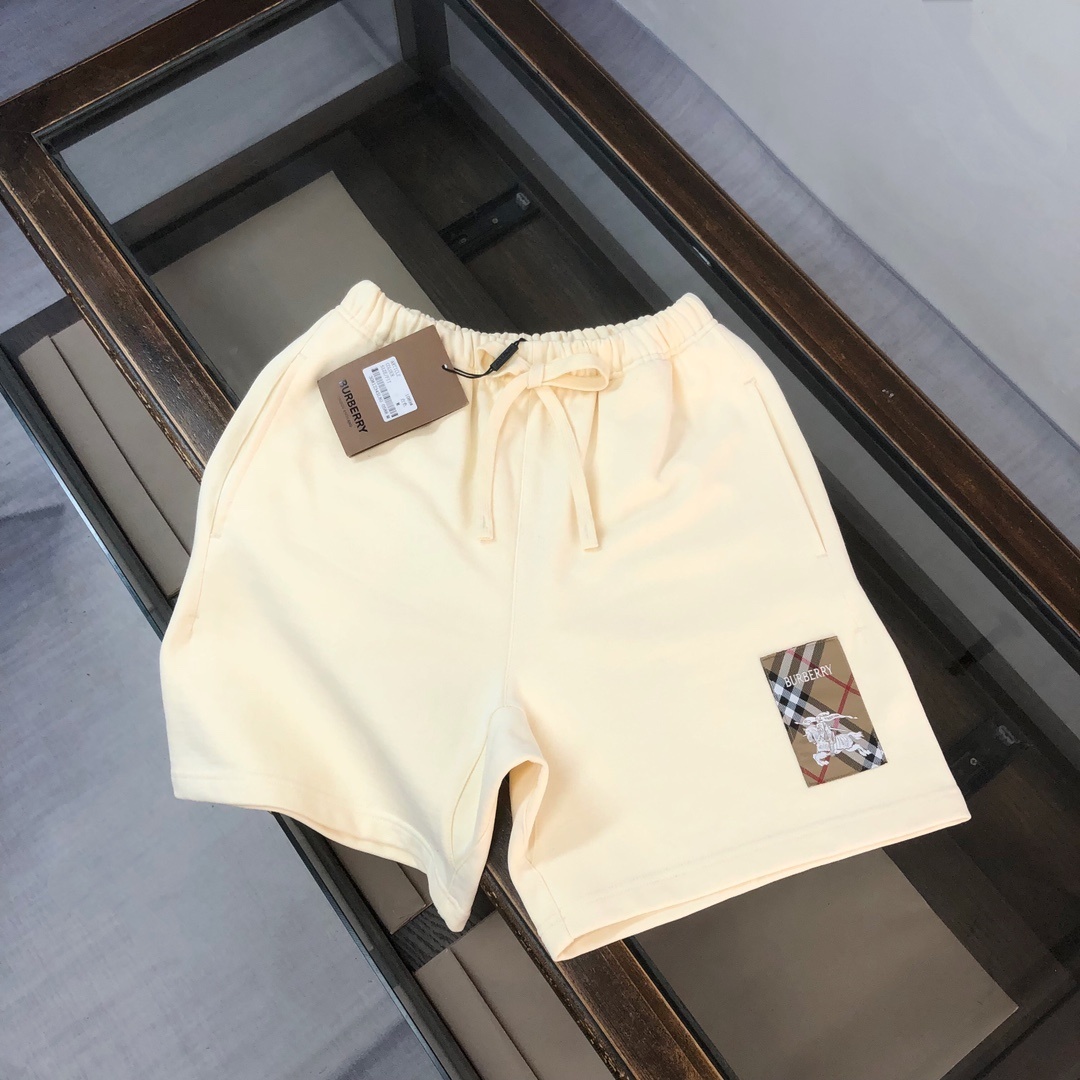 Burberry Check Label cotton shorts in a cream or light yellow
