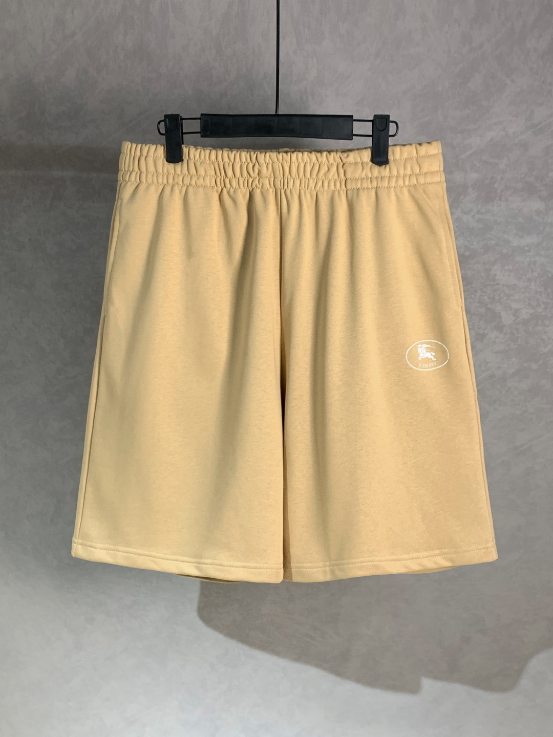 Burberry Knight Stamp cotton shorts in flax beige.