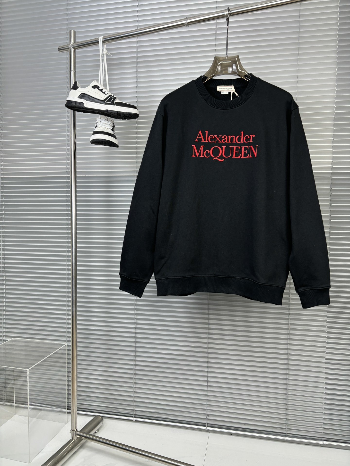 Alexander McQueen black cotton logo sweatshirt with a red logo print.