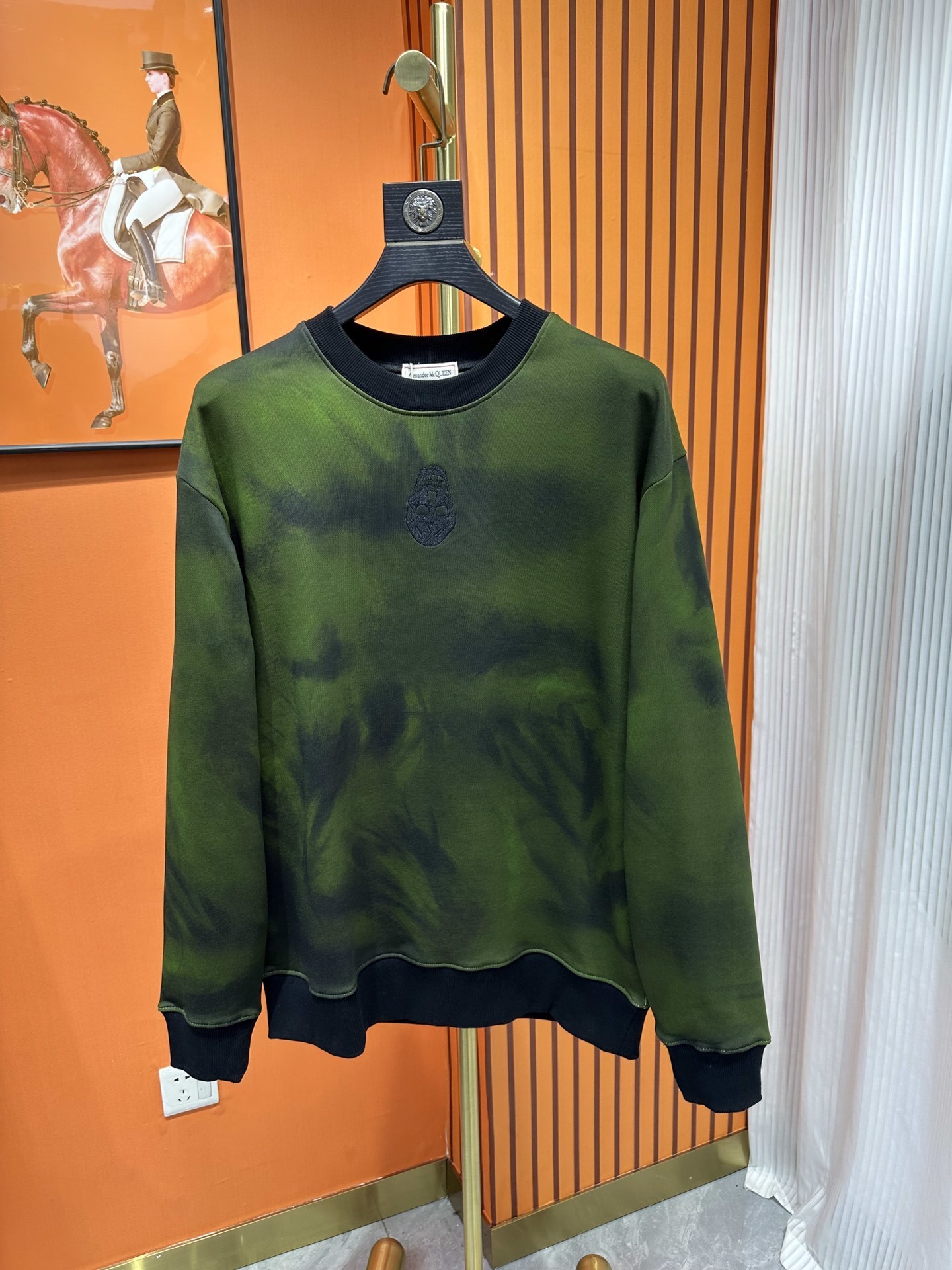 Alexander McQueen green and black tie-dye crewneck sweatshirt.