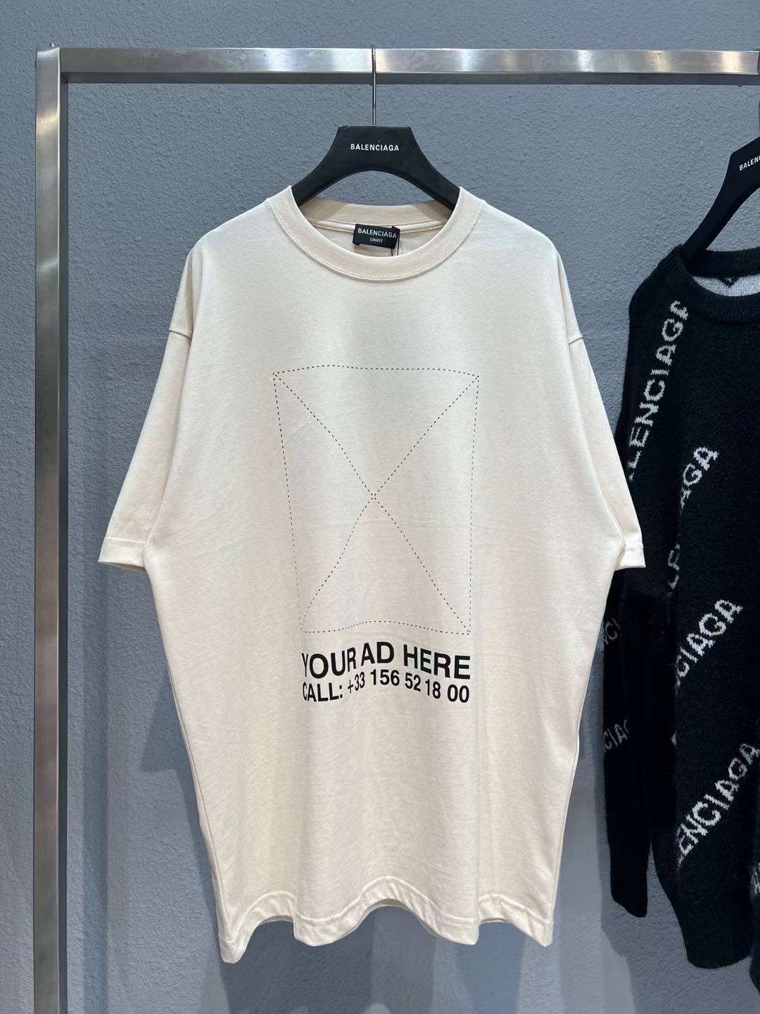 Balenciaga logo T-shirt in nude or off-white cotton.