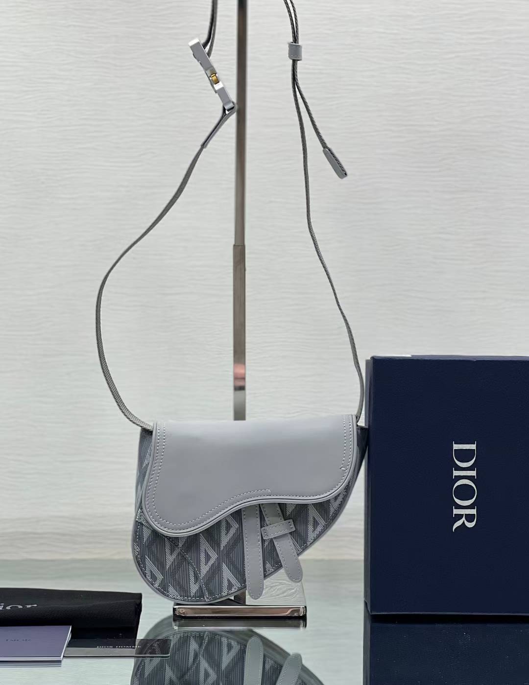 Christian Dior Saddle bag in grey CD Diamond coated canvas and calfskin leather.