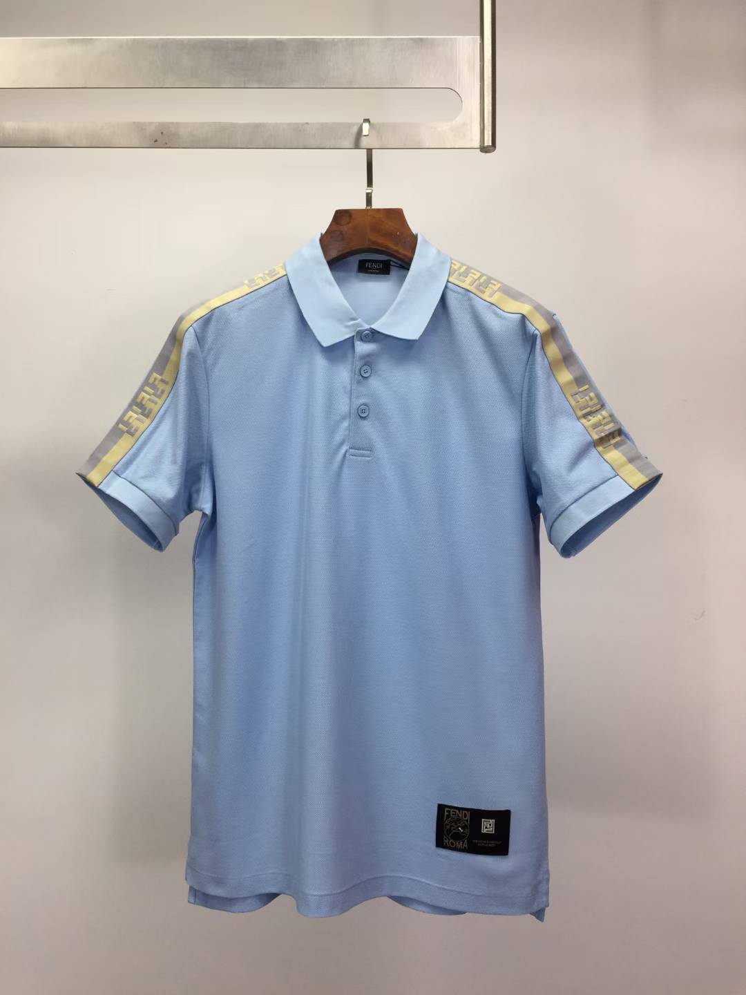 fendi polo shirt with a check motif on the sleeves and collar light blue