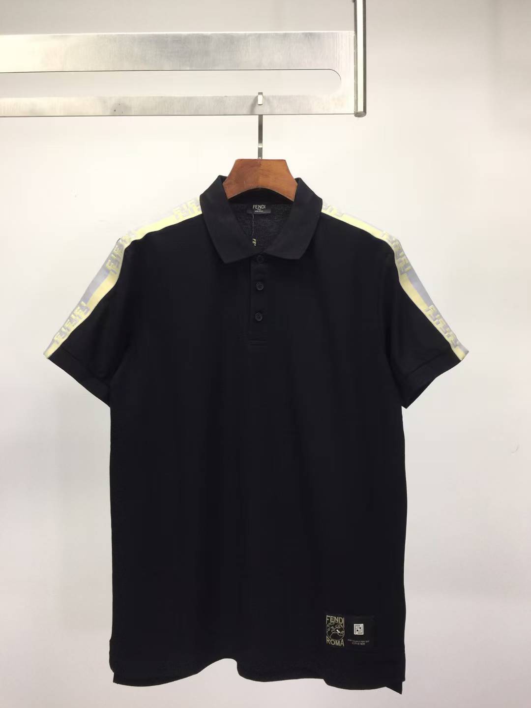 Fendi black men's polo shirt with light-colored detailing on the shoulders and sleeves
