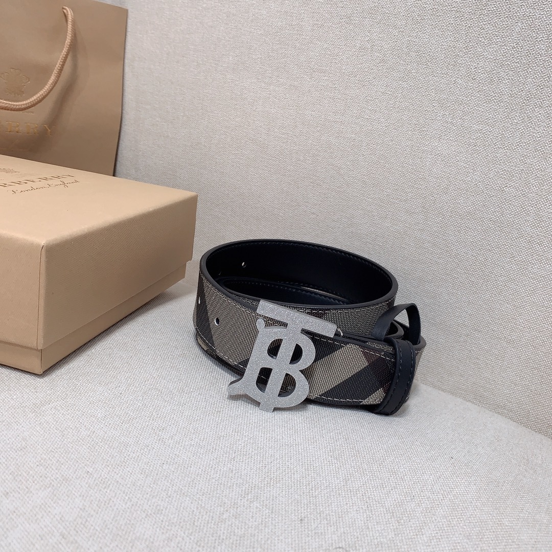 Burberry Reversible Check TB Belt with a dark graphite Thomas Burberry Monogram plaque buckle, likely in leather and canvas.