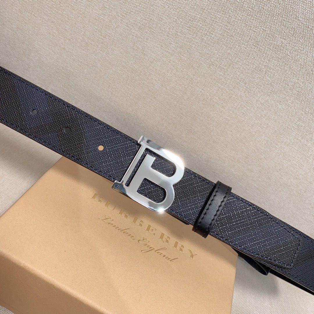 Burberry Reversible Check TB Belt in a black leather with a silver-tone TB monogram plaque buckle.