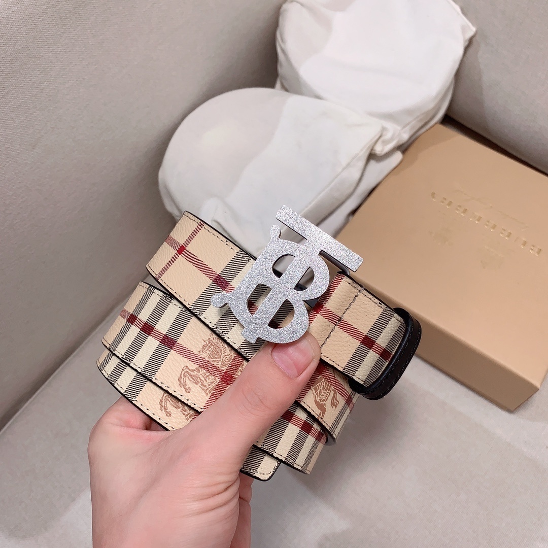 Burberry Reversible Check TB Belt with a silver-tone monogram buckle.