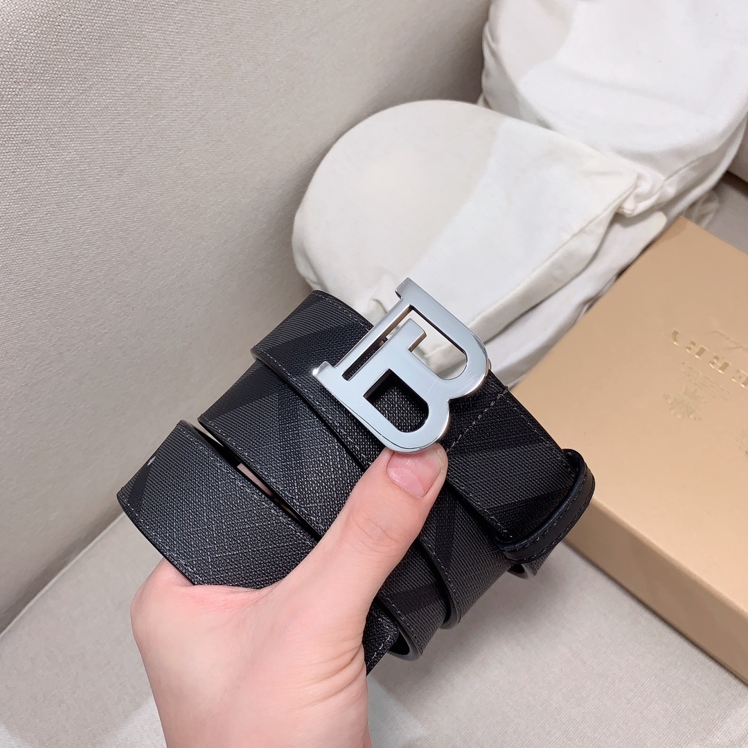 Burberry Reversible Check TB Belt in charcoal and graphite from thermoplastic polyurethane, cotton, and leather.