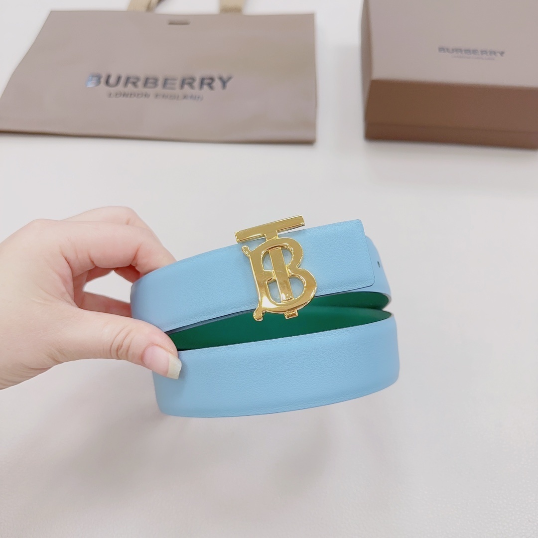 Burberry Reversible Leather TB Belt in a light blue and green bicolor design with a gold-plated Thomas Burberry Monogram buckle.