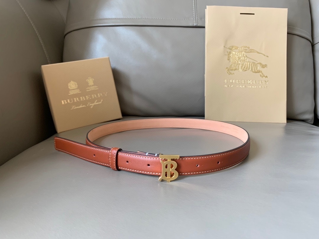 Burberry Reversible Monogram Motif Leather Belt in a brown tone with a gold-tone TB monogram plaque buckle.