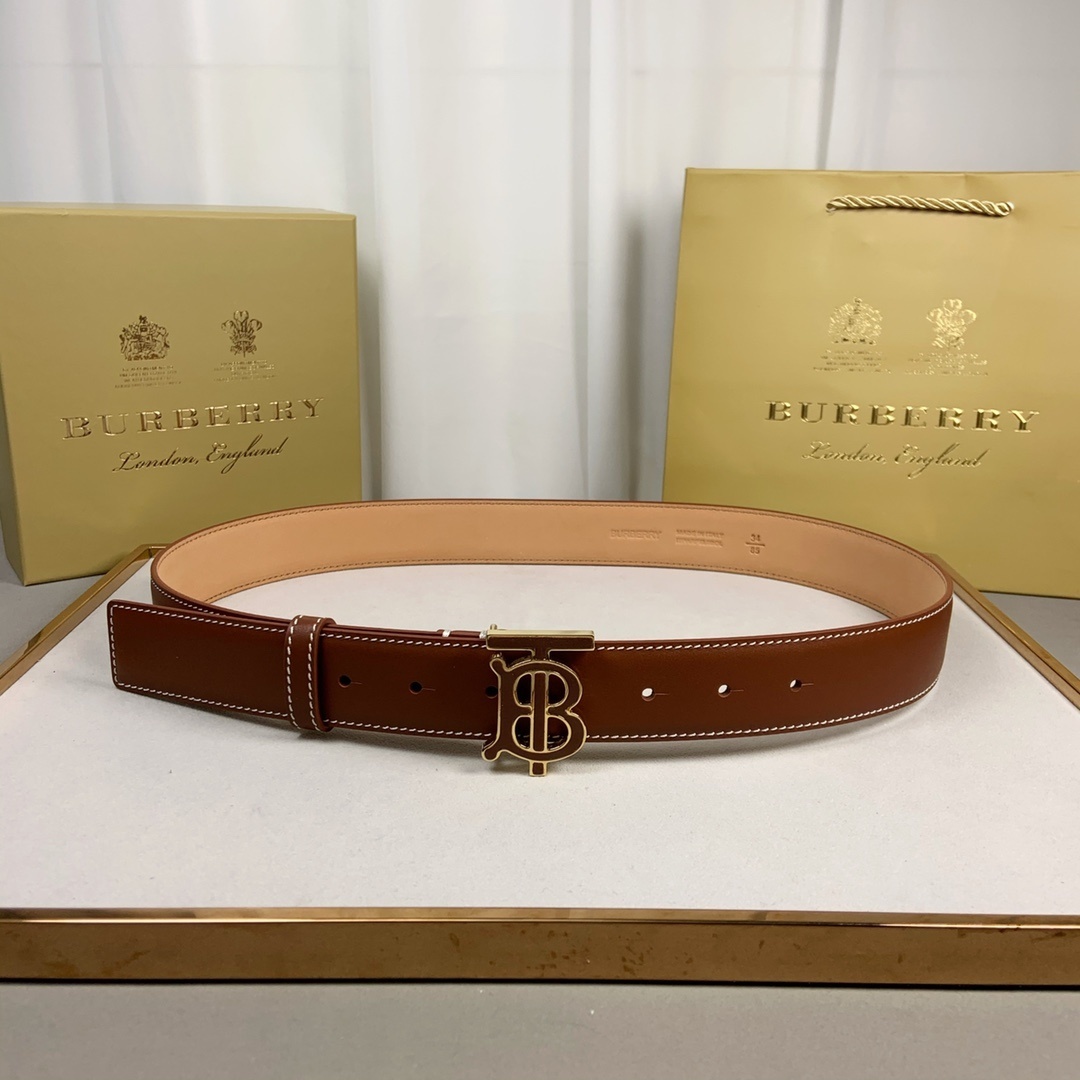 Burberry reversible leather belt in brown calf leather with a gold-plated Thomas Burberry Monogram plaque buckle.