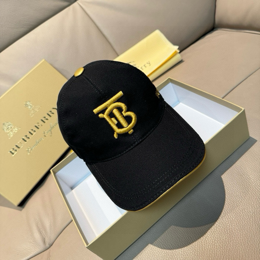 Burberry cotton gabardine baseball cap with a gold-tone 'Thomas Burberry Monogram' logo.