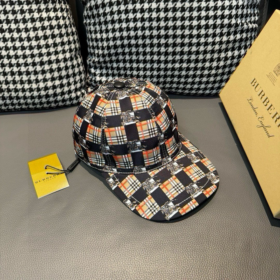 Burberry Check baseball cap in a black and plaid design with an adjustable strap.