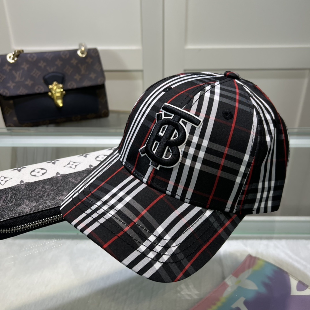 Burberry baseball cap featuring the black, white, and red check pattern and an embroidered TB monogram logo.
