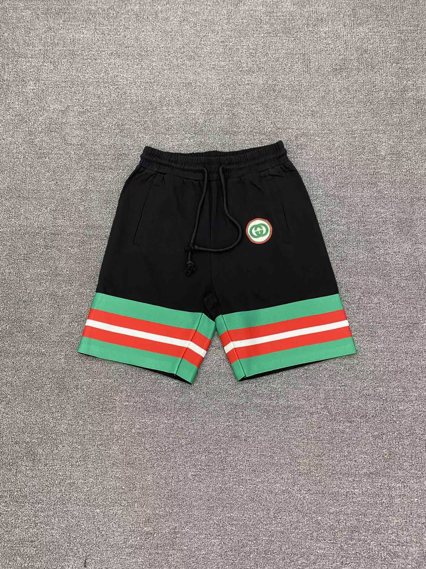 Gucci Web-Stripe GG Track Shorts black cotton with an elasticated drawstring waistband and signature Interlocking G logo patch.