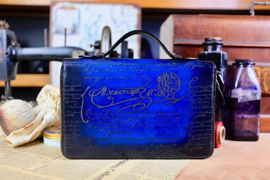 Berluti Scritto leather clutch bag in navy blue