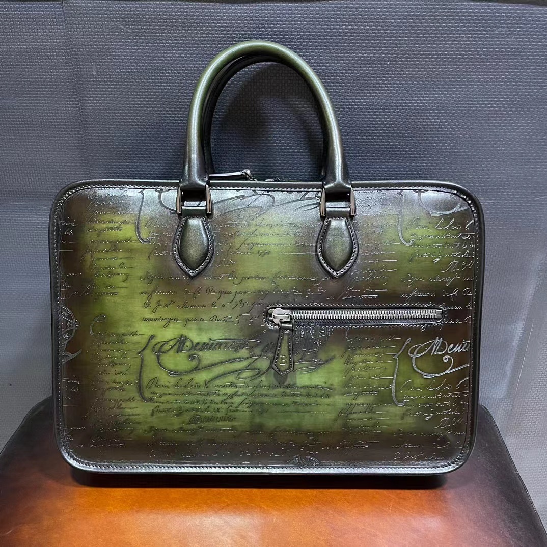 Berluti 1 Jour Neo Scritto Venezia leather briefcase in a dark green patina finish.