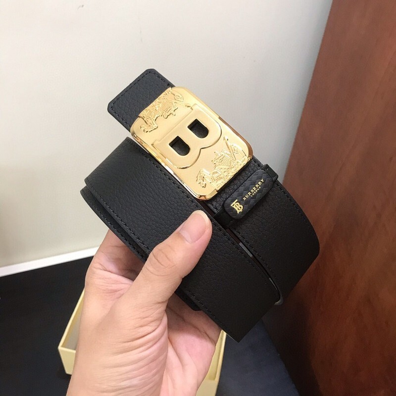 Burberry black leather belt with a gold TB monogram buckle.