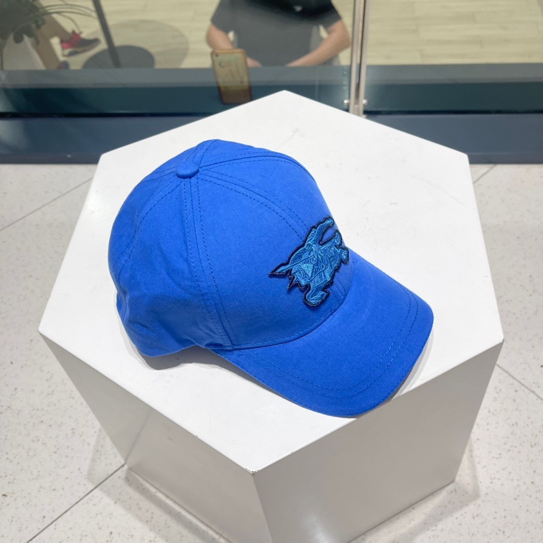 Burberry EKD-appliqué cotton baseball cap in deep cobalt blue.