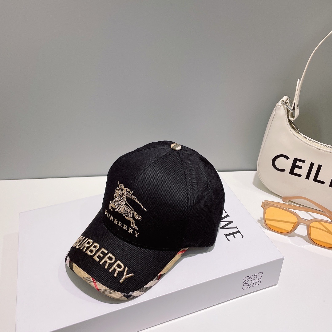 Burberry black cotton gabardine baseball cap with the Equestrian Knight logo and Vintage Check pattern on the brim.