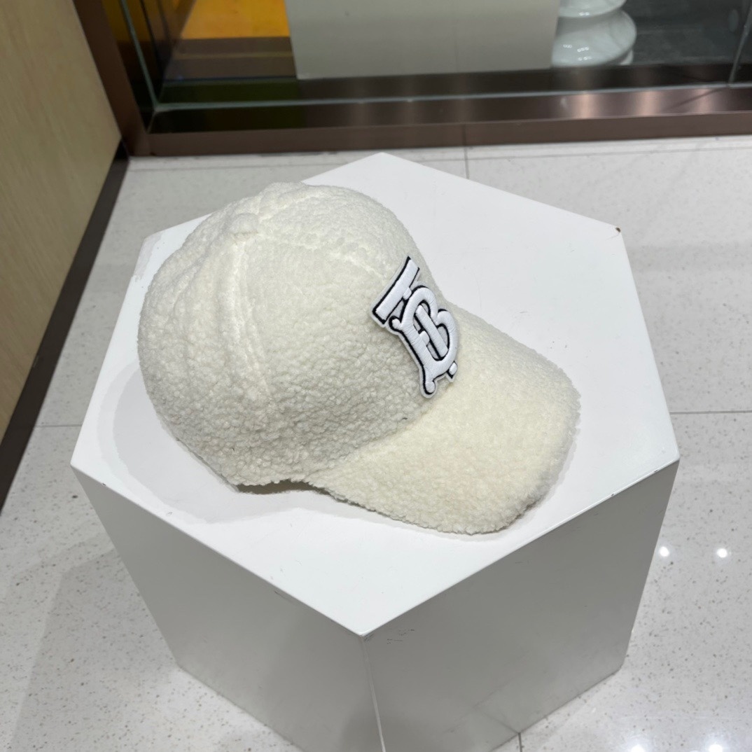 Burberry Monogram Motif shearling baseball cap in off-white material.