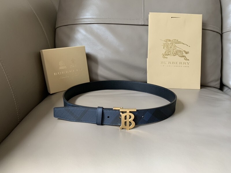 Burberry reversible check TB belt with a gold-tone B buckle, featuring navy blue leather and a check pattern.