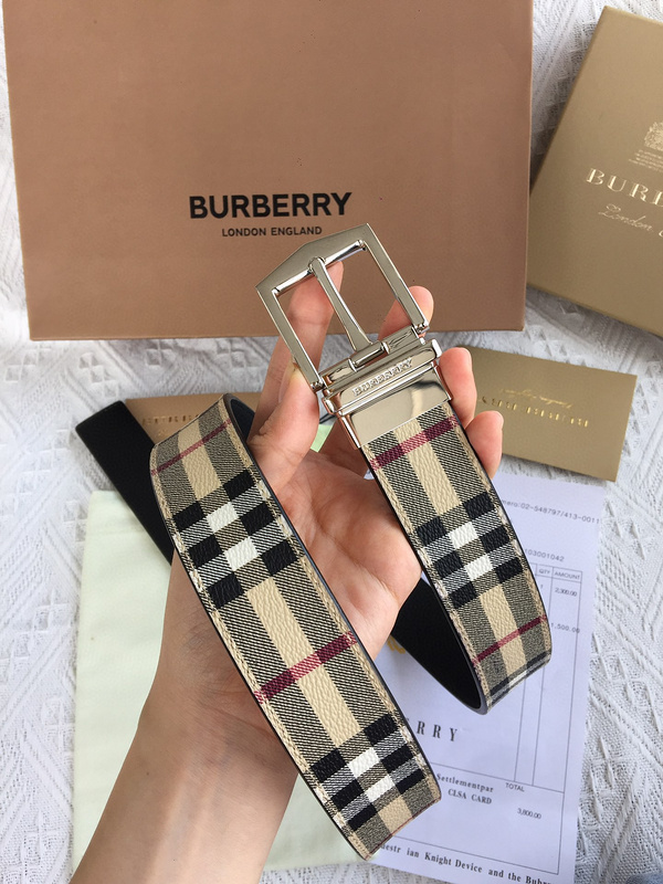 Burberry Reversible Check E-canvas and leather belt in archive beige with a silver-tone plaque buckle.